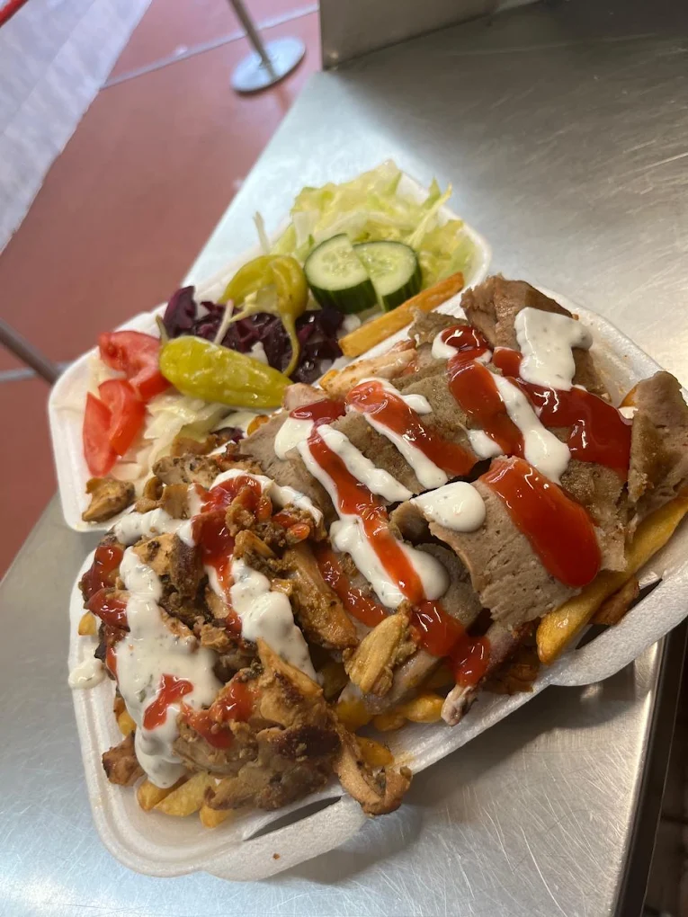 Mixed doner and chicken kebab box with chips, salad and sauces at Kebab House Brighton